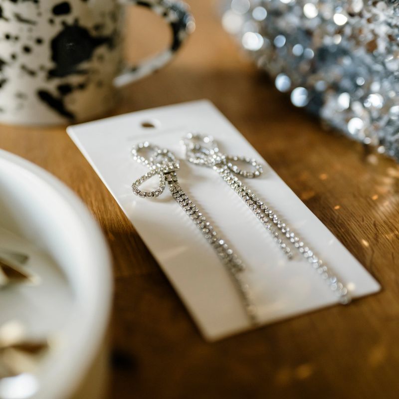 festive sparkling earings jewelry for new years eve bling sequinPhoto of natural setting