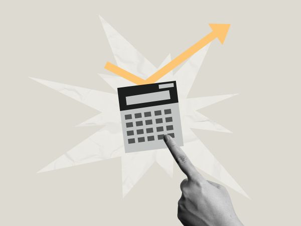 Hand pointing at calculator with upward trending arrow graphic.