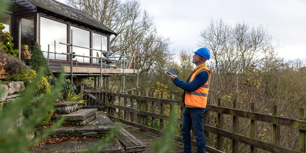Fencing professional assessing a residential property