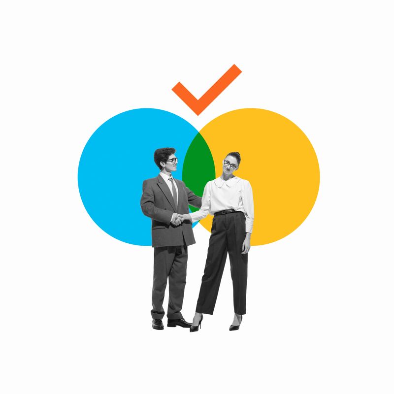 Two business people, partners shaking hands in front of intersecting circles symbolizing agreement and collaboration in partnerships. Conceptual design. Concept of business model, strategy, success