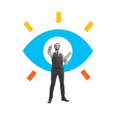 Businessman pointing forward with an eye graphic behind him symbolizing vision.