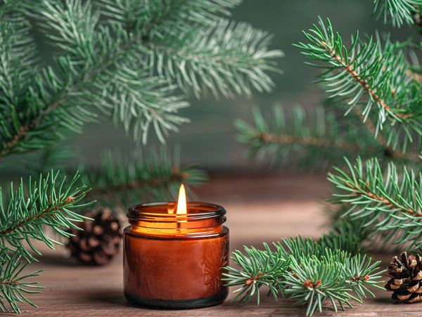 Candle burning inside bottle and leaf