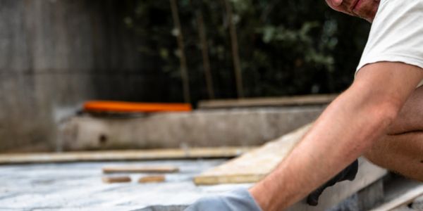 Person working on a construction or renovation project outdoors.