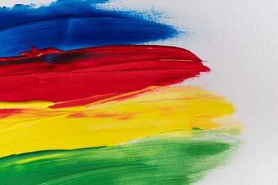 Abstract paint strokes in blue, red, yellow, and green.