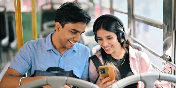Two young people enjoying a video on a phone.