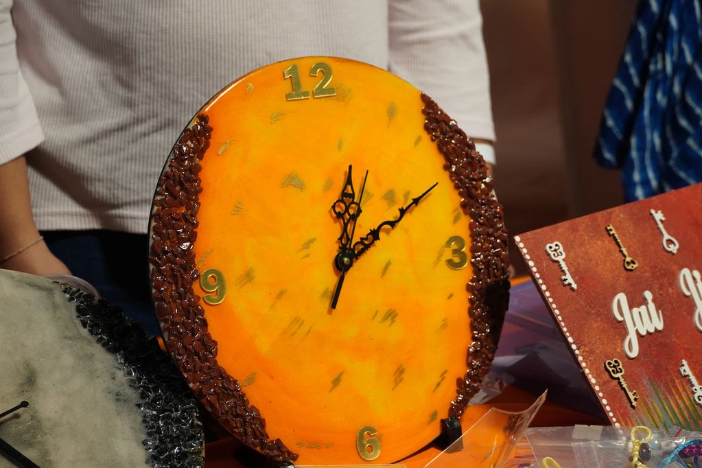 Brighten up your walls with this vibrant amber orange resin wall clock crafted with premium epoxy re