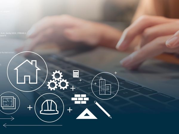 Hands typing on a laptop with construction and architecture icons overlay.