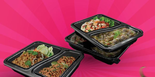 Meal prep containers with various healthy dishes on a pink background.