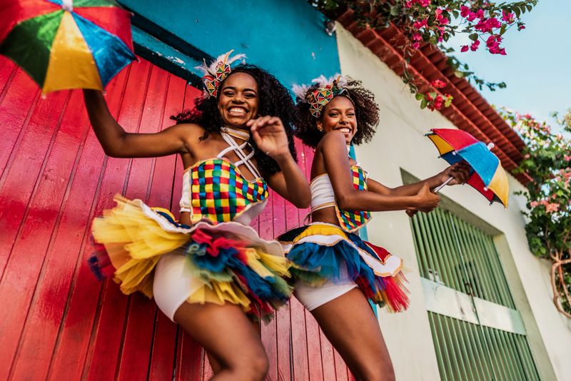 Portrait of friends having fun during street carnival party