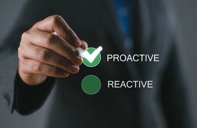 Hand selecting proactive over reactive option.