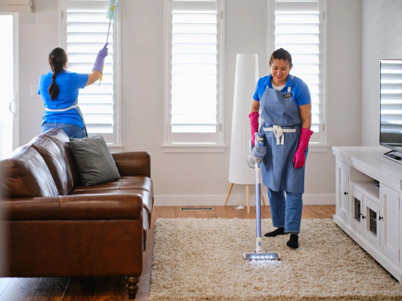 Professional housecleaning service at work in a home.
