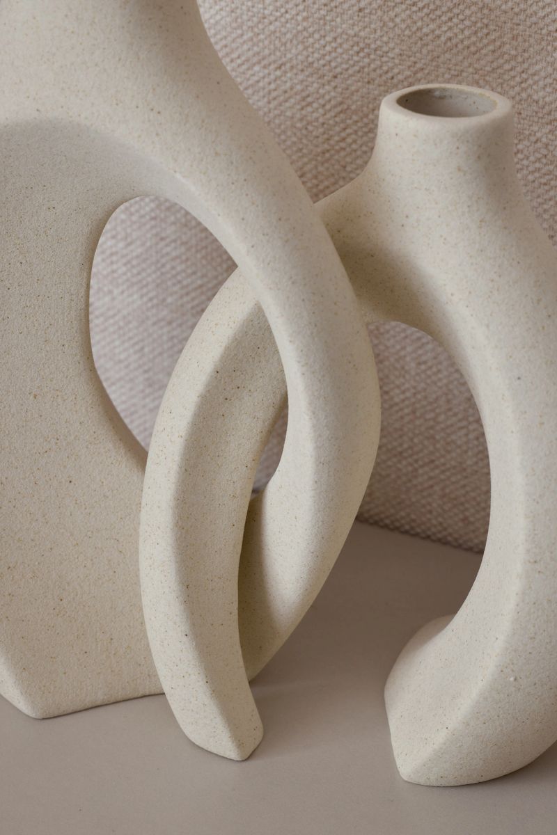 Stylish abstract vases that showcase elegant contours along with their muted and sophisticated colors