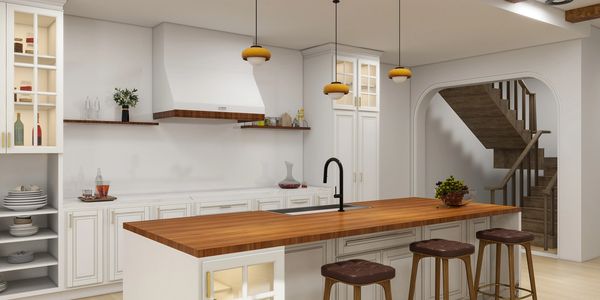 Modern kitchen with wooden island and pendant lights.