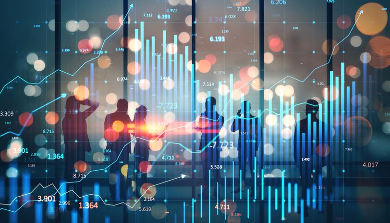 Silhouettes of people in discussion, financial graphs and charts overlay, bokeh background, concept of global market trends and strategy
