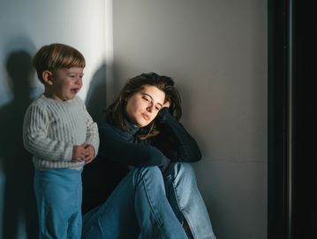 overwhelmed mom with crying child