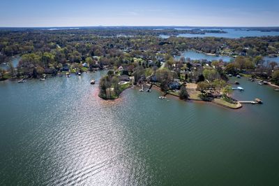 Aerial view of a lake with houses along the shoreline.