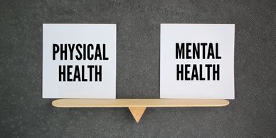 Balance between physical and mental health shown on a scale.