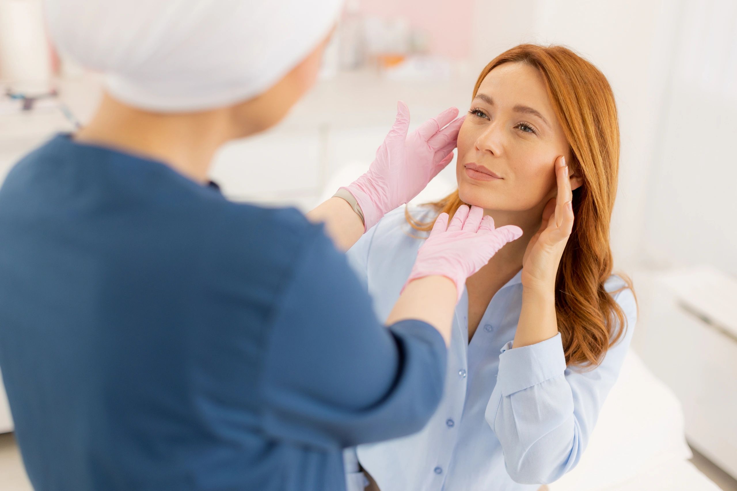 an aesthetician helping a client with Cancer by doing a facial something pretty and calming