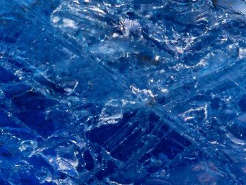 Close-up of intricate blue ice crystals.
