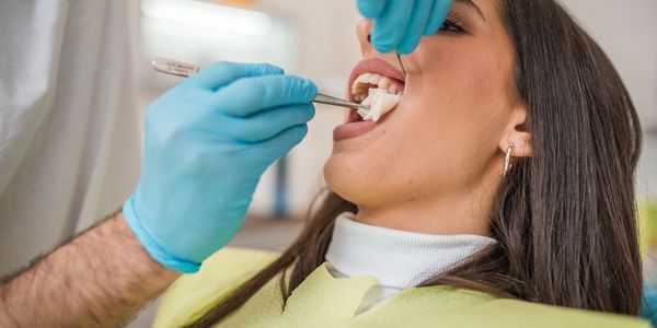Dentist performing gentle tooth extraction at Myrtle Dental Clinic South Morang