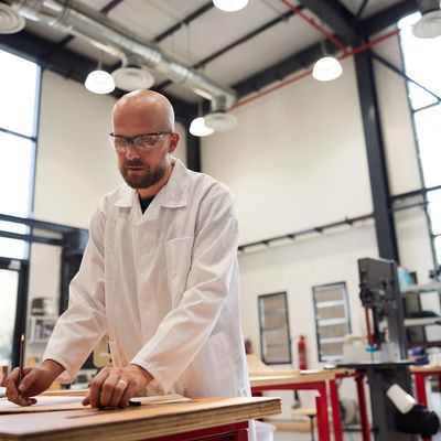 Scientist in a white lab coat working in a ISO 17025 laboratory