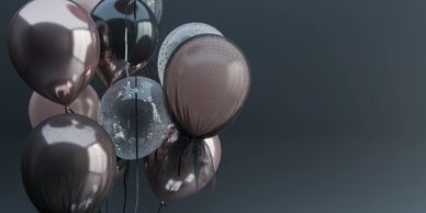 Elegant balloons in shades of rose gold and black, perfect for party decorations and celebrations.