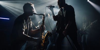 Musicians performing live on stage.