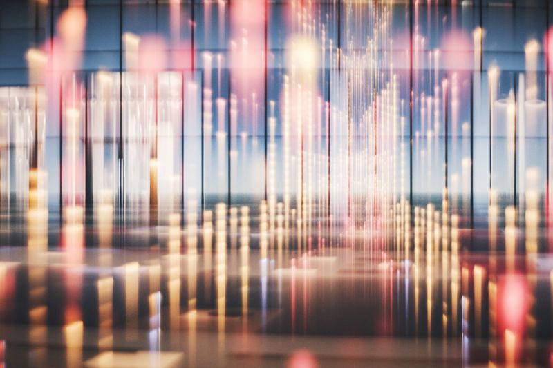 Abstract office building exterior with light trails. 3D generated image.