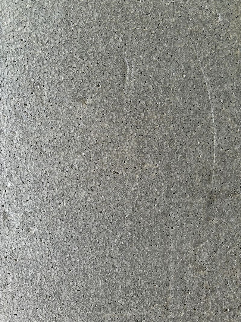 Gray polystyrene insulation foam background. Full frame polystyrene texture