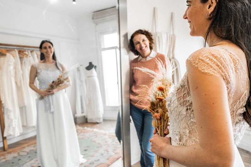 Bride with her mother in a bridal shop