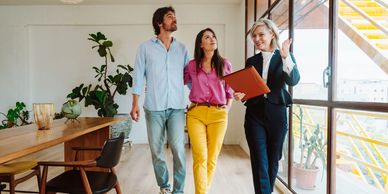 Real estate agent showing couple around a home
