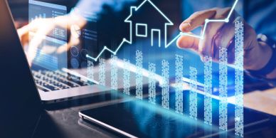 A person analyzing real estate data with digital graphs and charts.