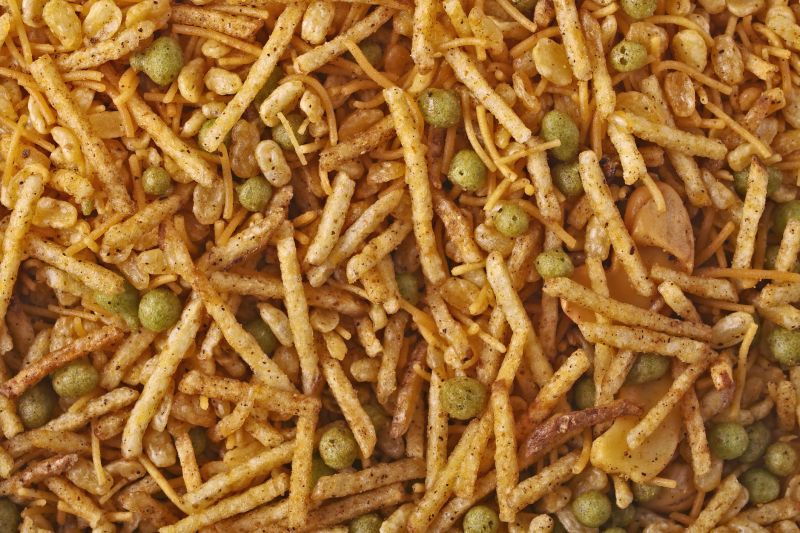 Directly above shot of Indian kashmiri mix snack food. Horizontal background texture.