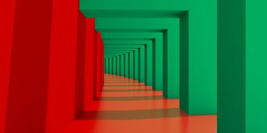 Red and green geometric corridor with repeating rectangular frames.
