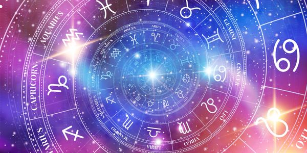 Spiral of zodiac signs glowing in cosmic purple and blue hues.
