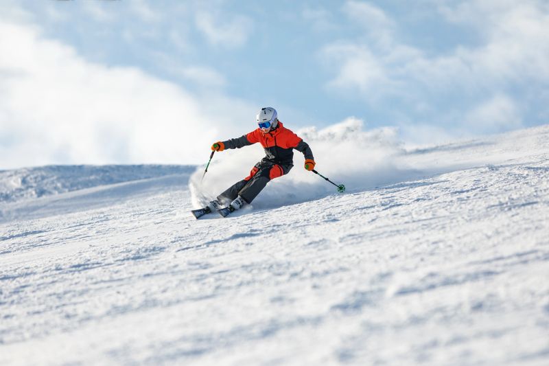Teenage boy spending winter holiday skiing in mountain