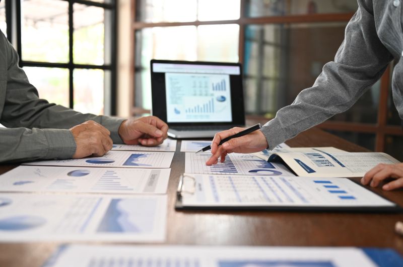 Business team are meeting and discussion for financial planning, business strategies and marketing research.