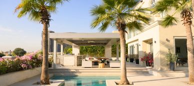 Blue pool with patio chairs