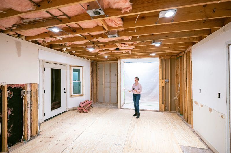Mature woman supervising home renovation progress