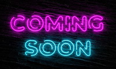 Neon sign displaying the words 'COMING SOON' in pink and blue.