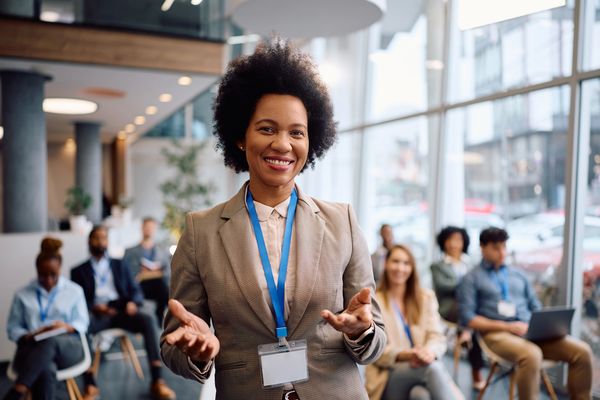 Confident woman speaking at a business seminar.