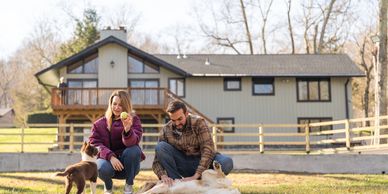 Homeowner with dog in clean backyard after monthly dog waste removal service in Cape Cod