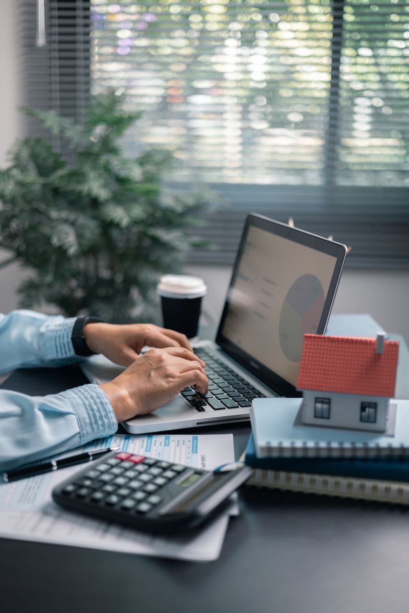 Finance bank tax expense accounting budget money businessman hand use Financial calculate accountant close up calculator with graph chart write office desk Business expense analysis saving home car
