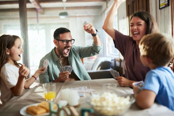 Family enjoying exciting card game