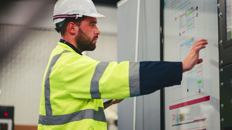 Engineers working in the main control room of a state-of-the-art chiller HVAC system.