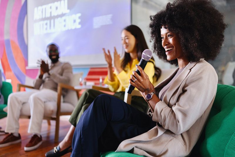 Portrait of a woman talking on an AI panel discussion