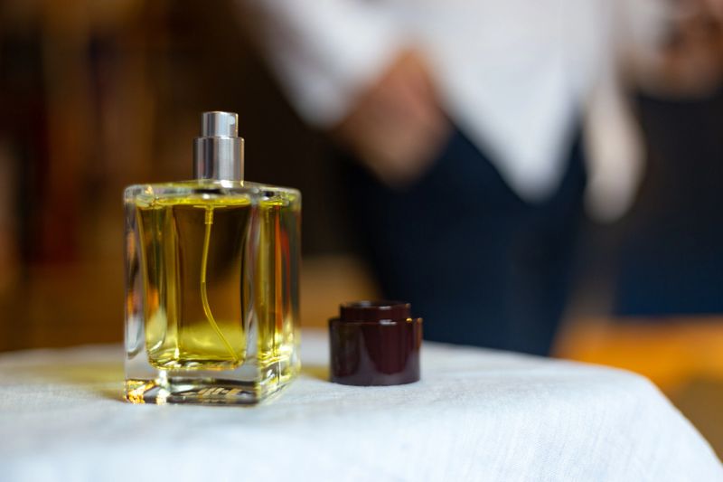 Madrid. Spain. Elegant perfume bottle showcasing its aromatic golden essence, evoking a sense of luxury and sophistication