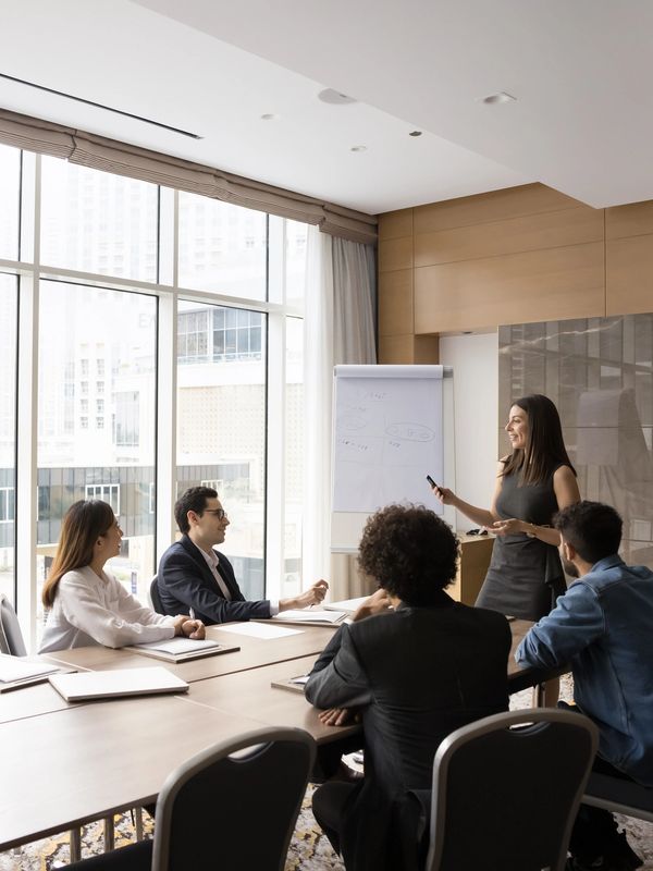 Group meeting in a modern office with a presentation.