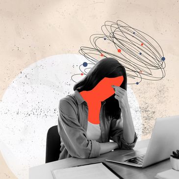 Overworked professional feeling stressed at desk, holding head in frustration from work pressure