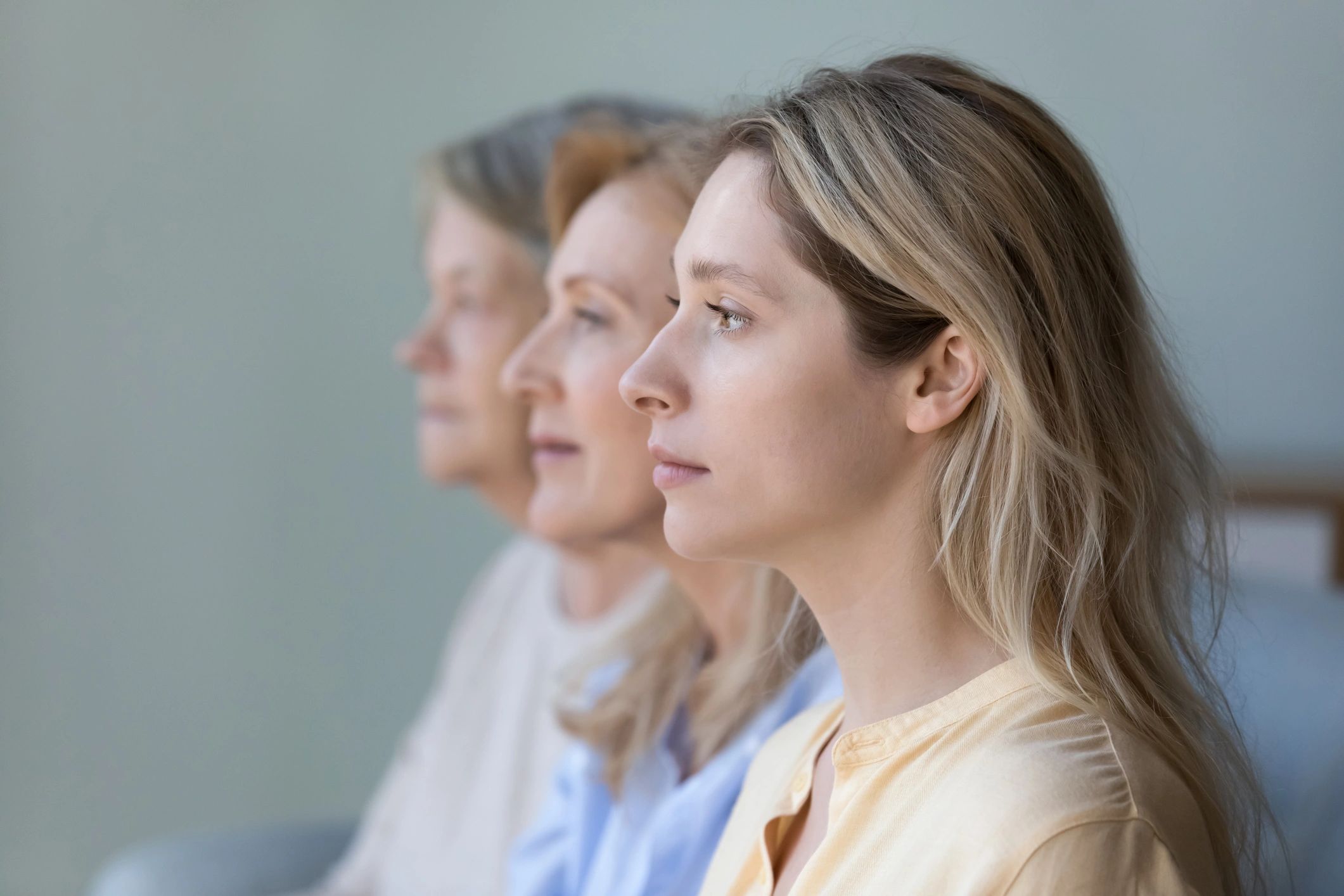 Side profiles of three women illustrating three generations. 